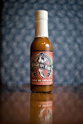 GARLIC INFUSED HOT SAUCE. A VAMPIRE CAN’T ROLL WITH A CRUCIFIX, DAYLIGHT OR BEAUTIFUL WOMEN EITHER....WUSS.