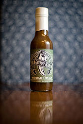 MANGO AND PINEAPPLE DESTROY THEIR ENEMIES IN A BRAWL FOR FLAVOR SUPREMACY. MILD HEAT IN THIS CHAMP.