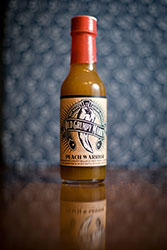 HOT SAUCE WITH A MIGHTY WALLOP OF SWEET PEACH. IT MURDERED THE COMPETITION IN AN EPIC BATTLE OF FLAVOR... WITH EASE.